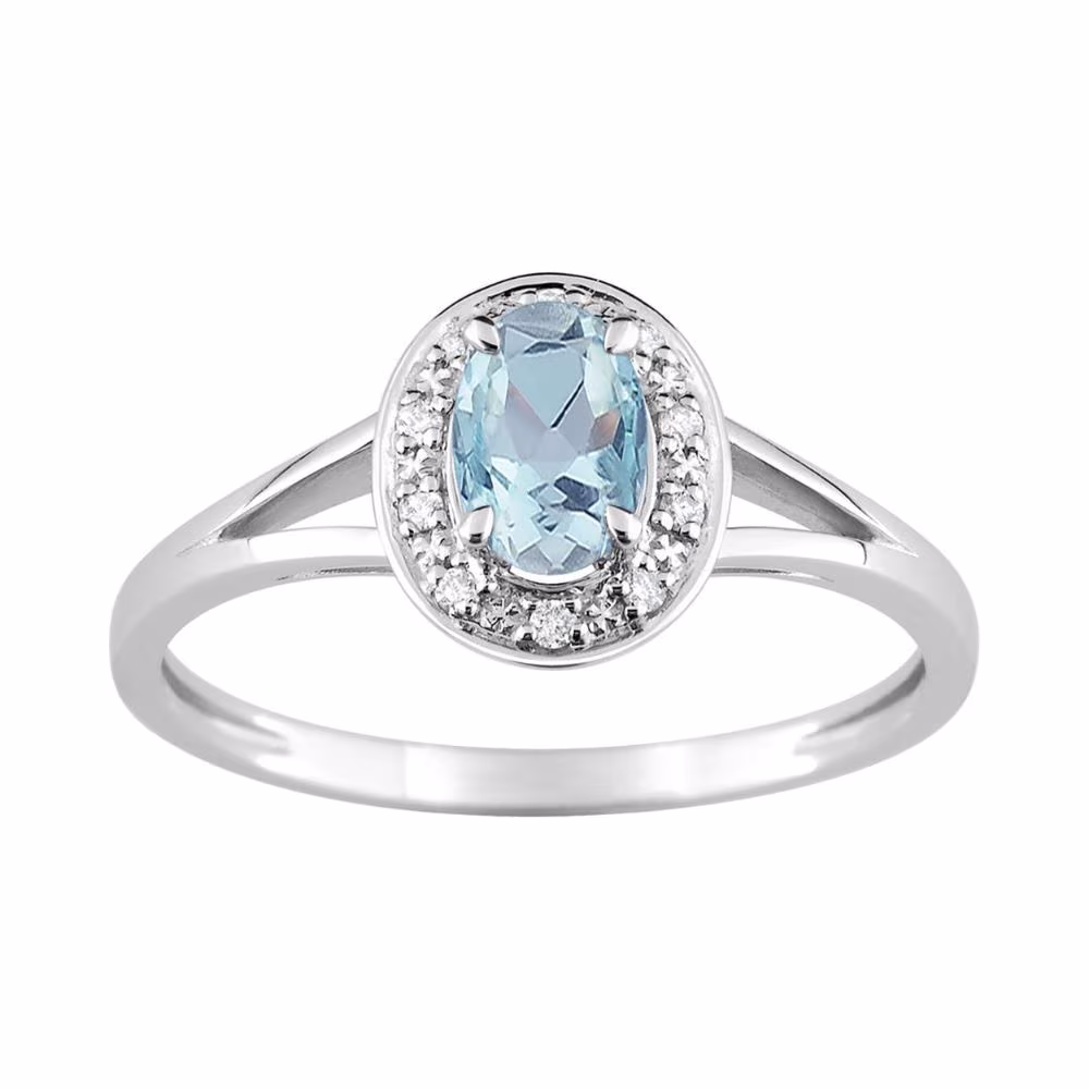 Bague topaze bleue ovale et entourage oxydes en or blanc